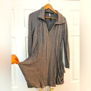 Cute and comfy grey long sleeve mini with zip neckline.
